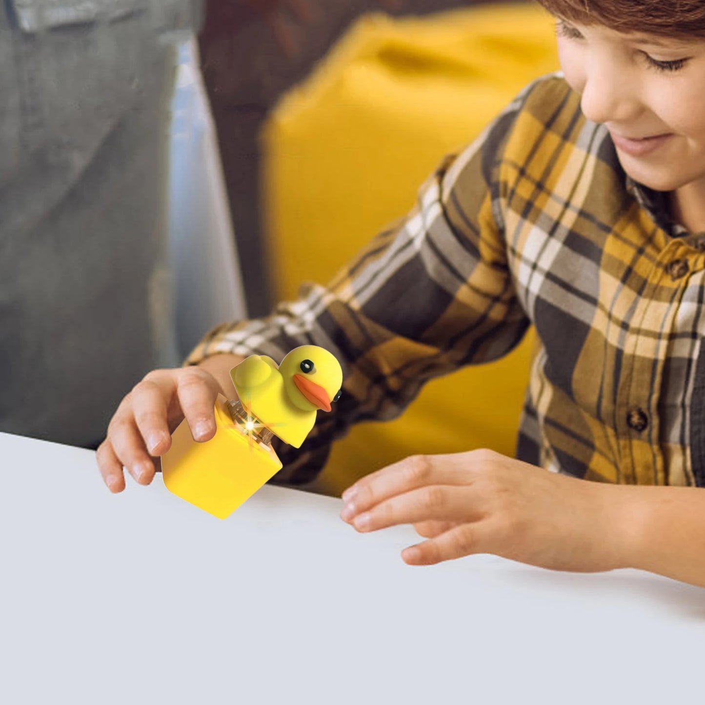 Child pressing the duck fidget toy on a backpack