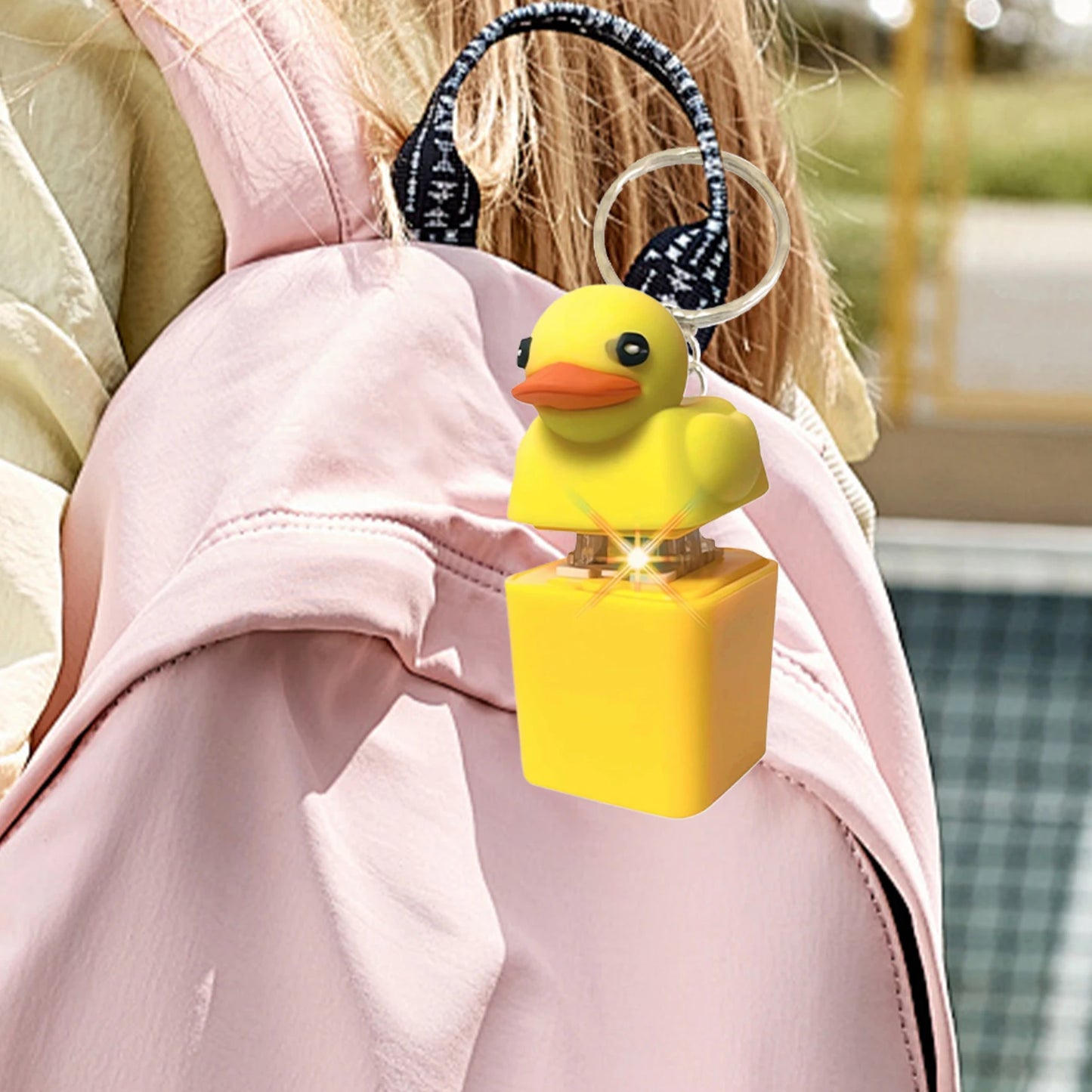 Close-up of duck toy keychain with light on