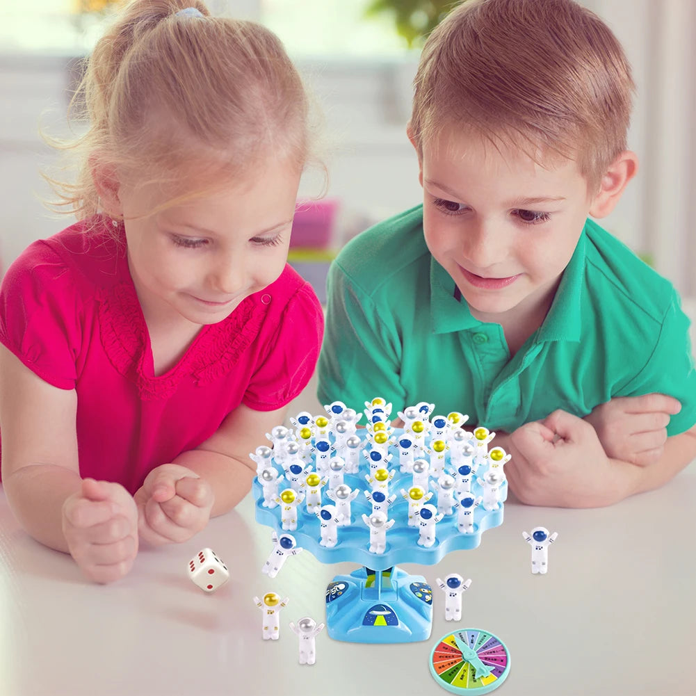 Children stacking spaceman pieces on balance tree for coordination practice