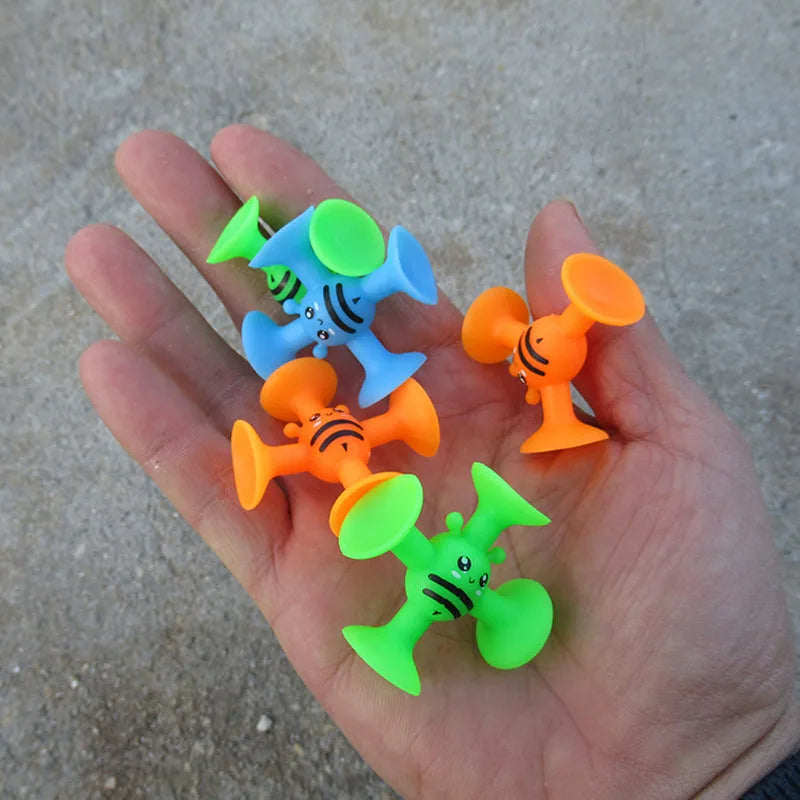 Portable suction cup bees for sensory and motor development