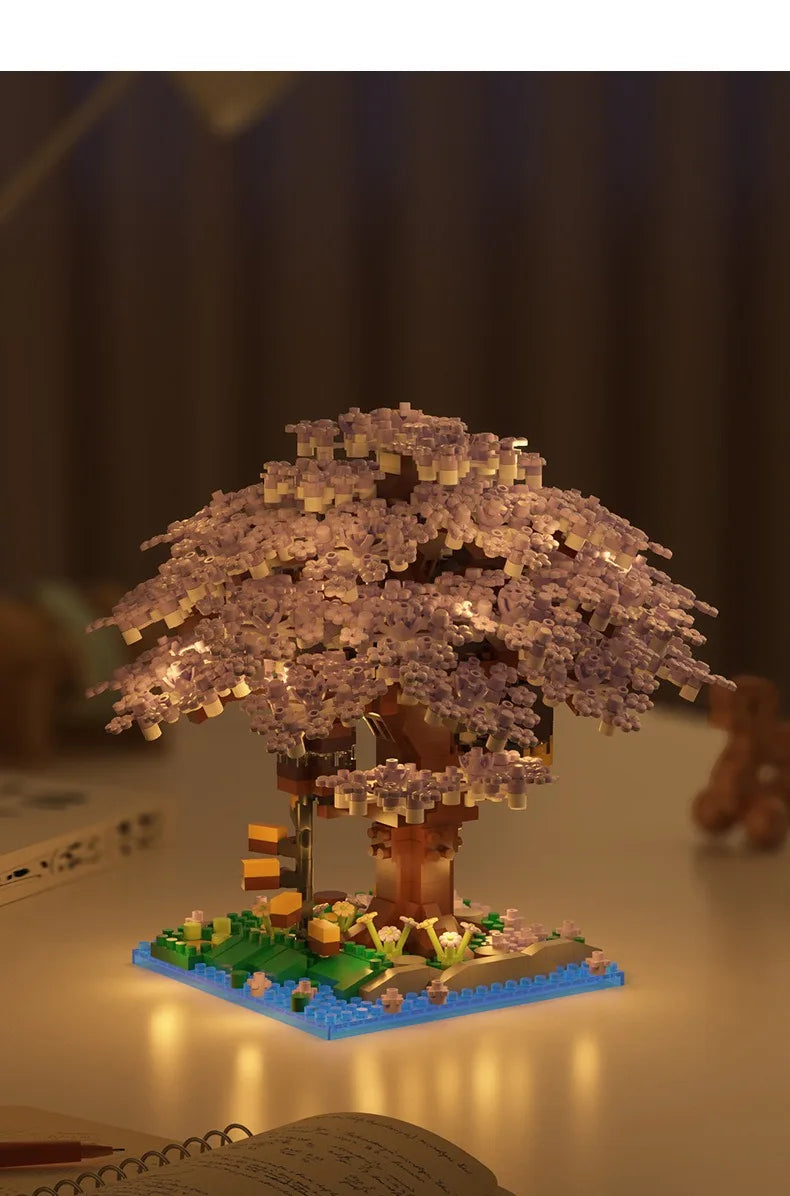 Completed pink cherry blossom tree house model made from detailed micro blocks.
