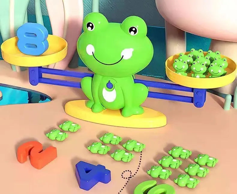 Preschooler learning math with frog toy