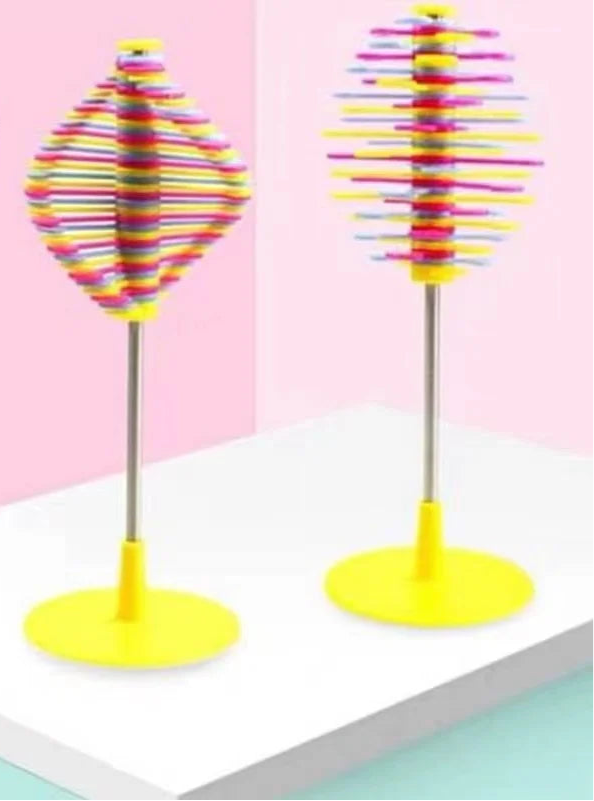 Compact spinning fidget toy in bright colours, designed for sensory relief and focus.