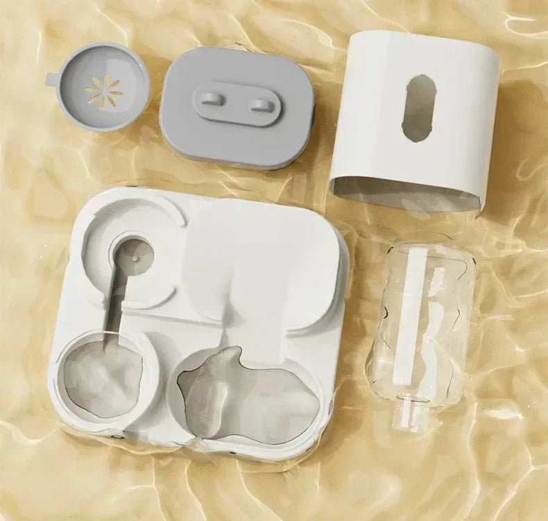 Set of silicone kitchen tools including a lid, container, and other components on a beige fabric background.