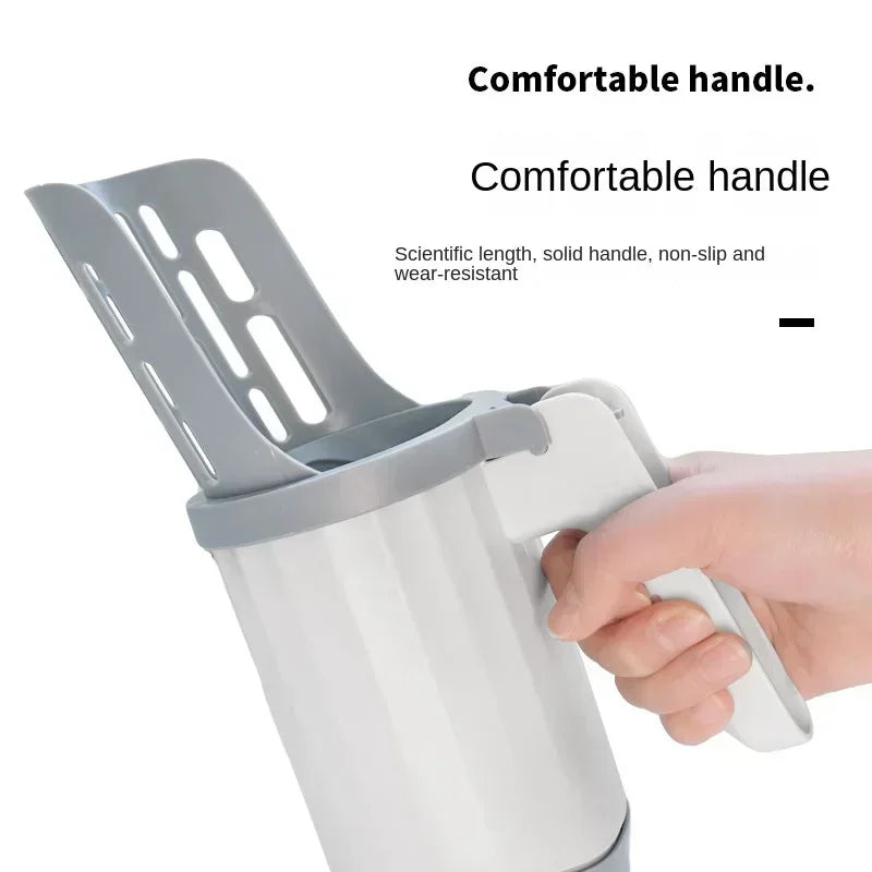 CleanMate™ litter scoop placed next to a multi-cat litter tray setup