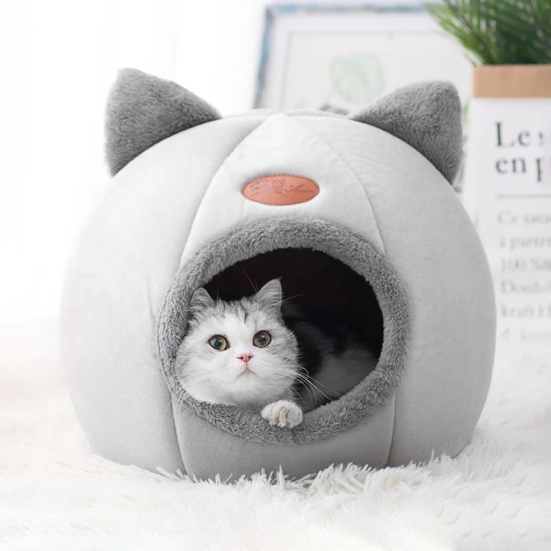 Winter cat cave bed with soft plush interior for deep sleep and warmth