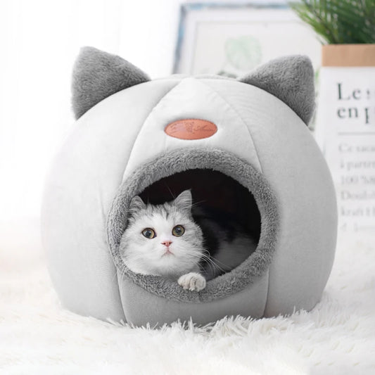 Winter cat cave bed with soft plush interior for deep sleep and warmth