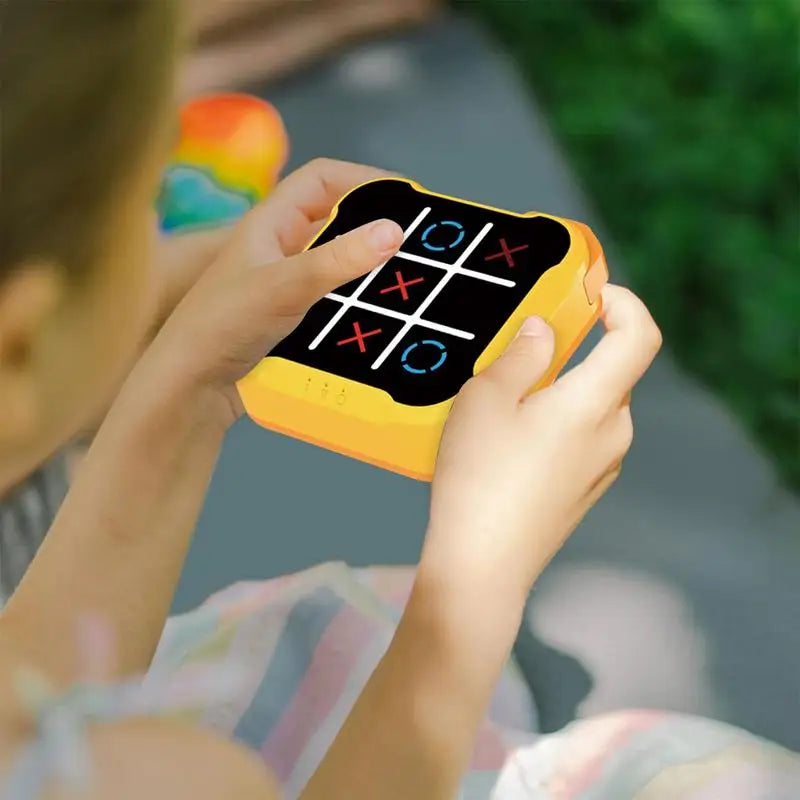 Child pressing light-up button on game board