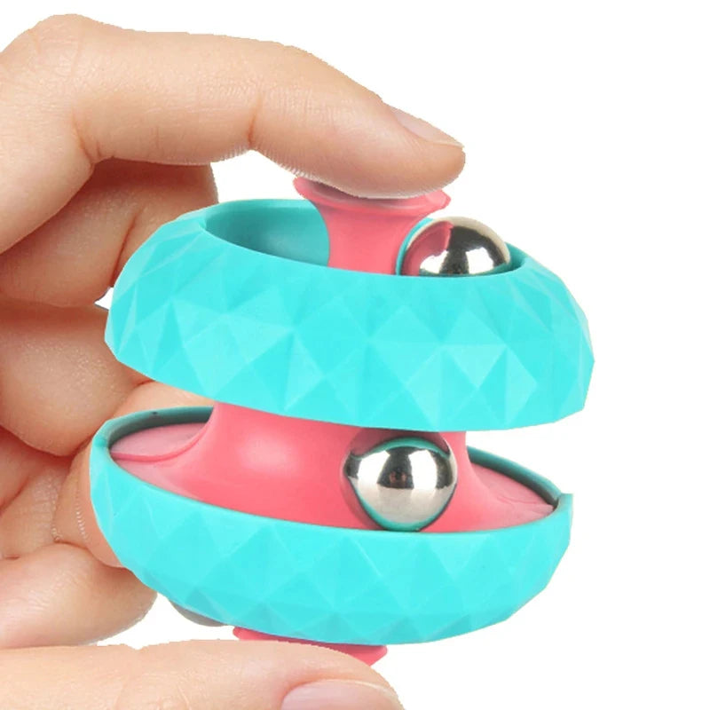 Teen fidgeting with InfinityOrbit™ stress toy during homework for better focus