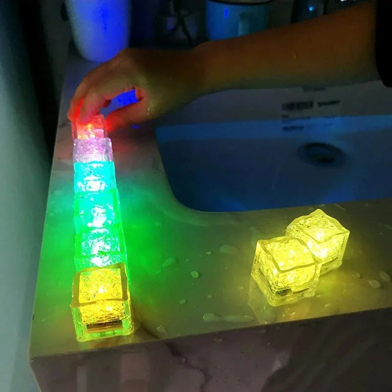 Baby playing with waterproof LED bath water cubes during bath time