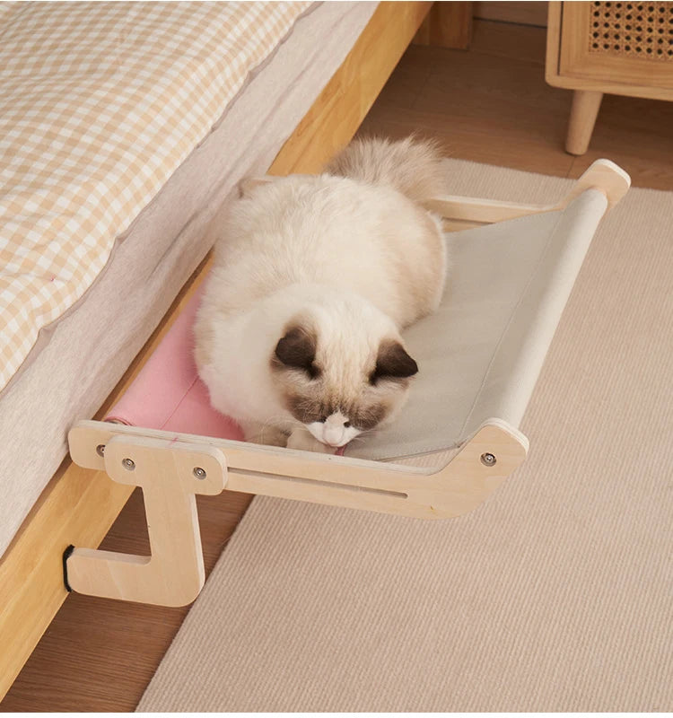 Space-saving cat window hammock in neutral tones for small apartments