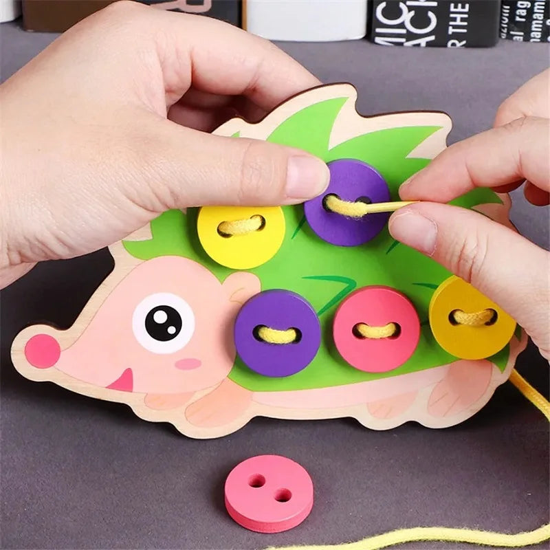 Child learning to lace and button with educational toy