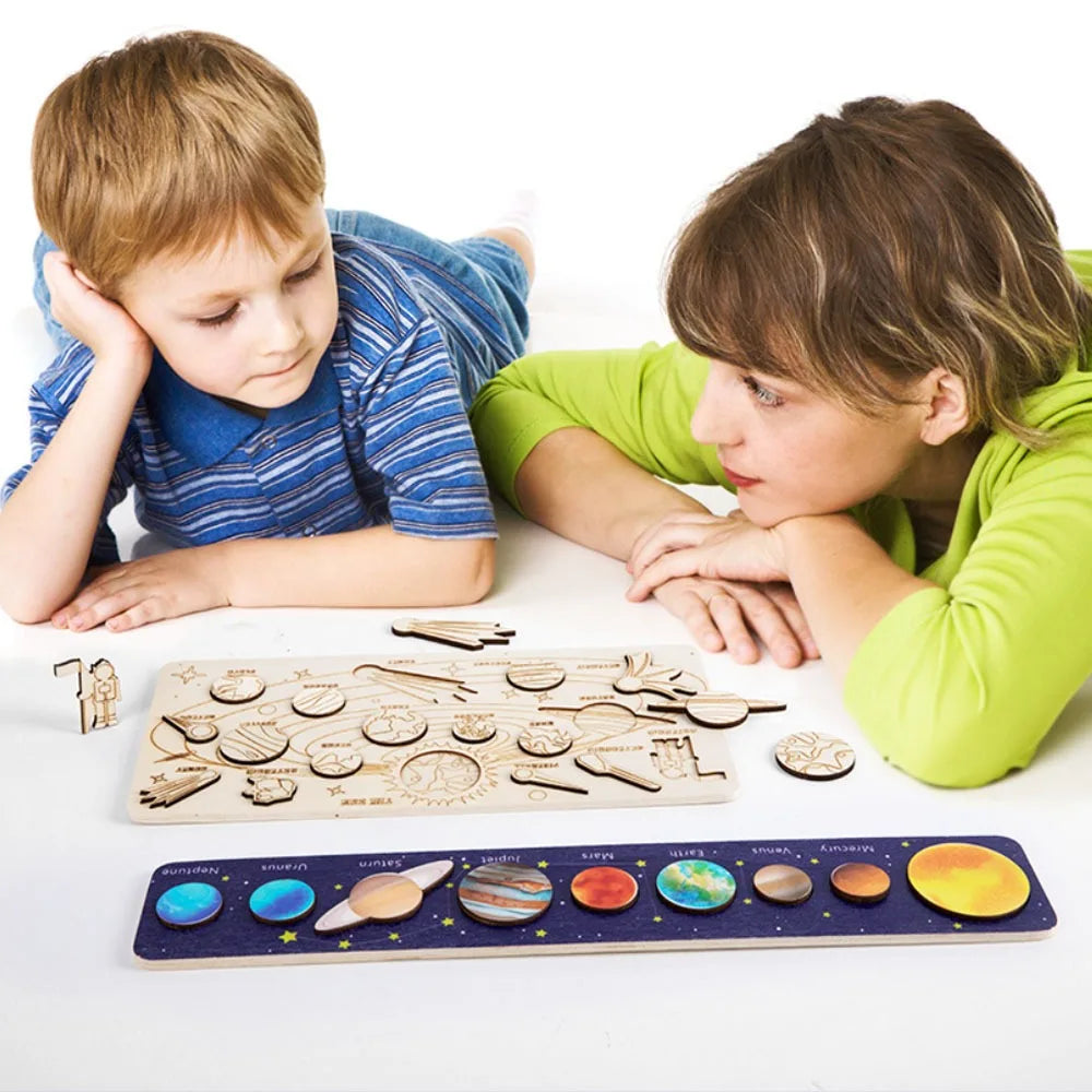 Child playing with movable planet toy