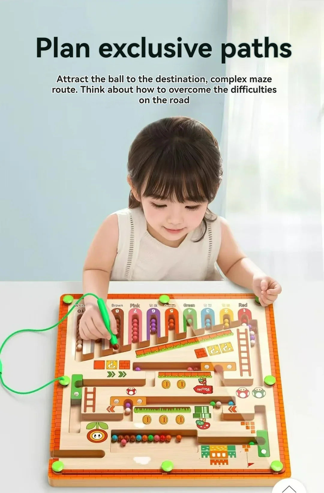 kid playing pen guided magnetic maze ball game