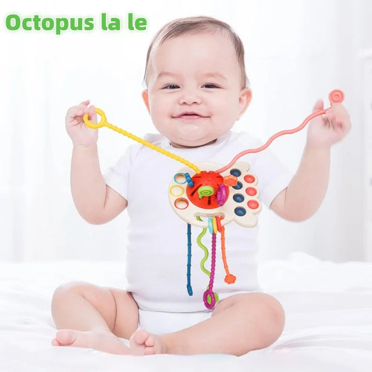 Toddler playing with baby sensory teething push and pull toy.