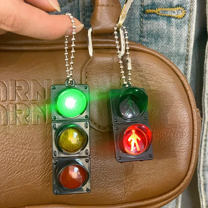 Mini traffic light toy with LED lights turned on – educational keychain