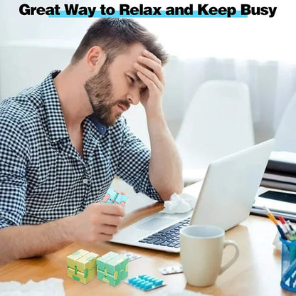 Adult using puzzle cube at a work desk

