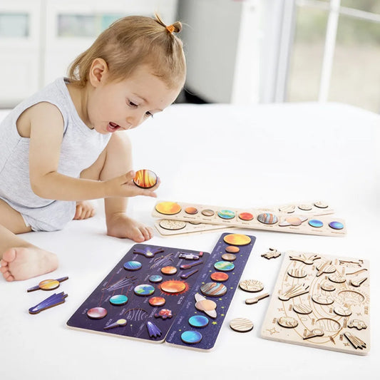Wooden solar system puzzle with movable planets